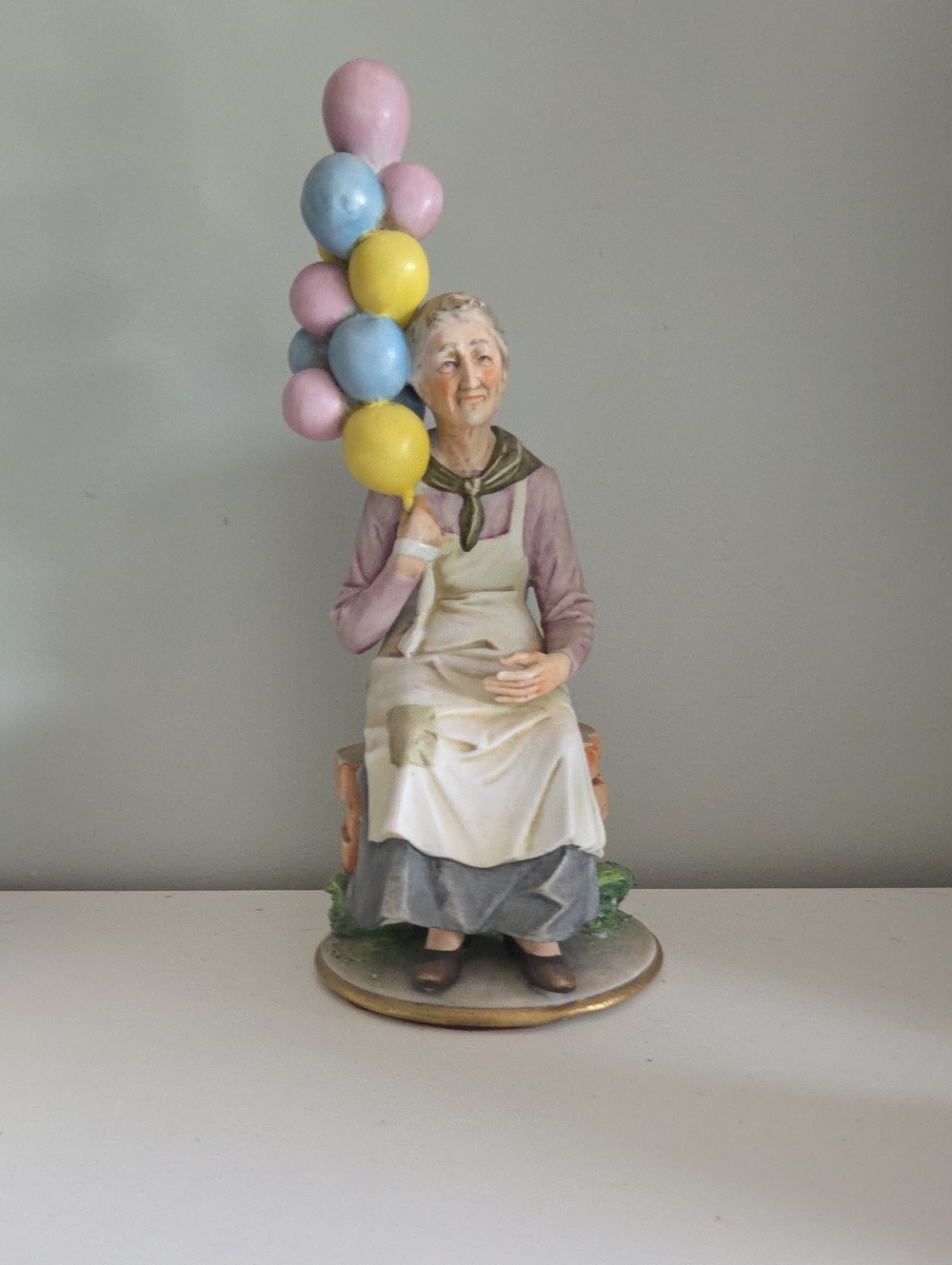 Vintage Pucci Capodimonte Elderly Woman Figurine with Pastel Balloons - Home Art